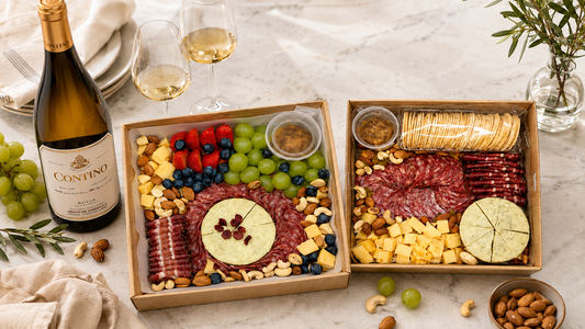 Two charcuterie and cheese board gift boxes with cured meats, herb cheese wheel, blueberries and nuts — The Cheese Board Singapore