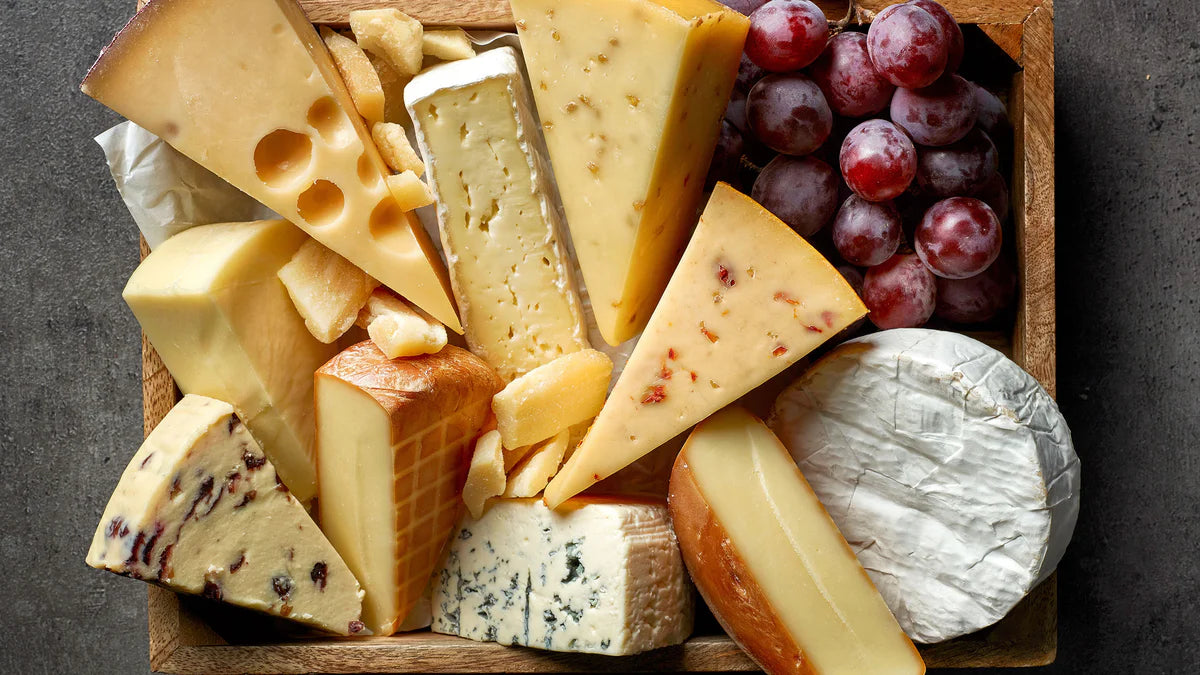 Assortment of imported artisan cheeses — soft, hard, and semi-hard varieties at The Cheese Board Singapore